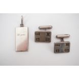 A pair of silver cuff links and a white metal '12 gram' ingot pendant, (tests as silver), 24.6g
