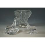 A Bohemian glass elephant, Baccarat glass seal and one other glass sculpture