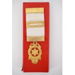 A gilt-metal Masonic jewel, in original carton