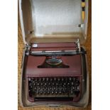 An Olympia portable typewriter, cased