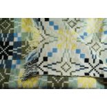 A vintage and traditional Welsh wool "tapestry" blanket, woven in tones of lemon yellow and blue,