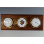 A bulkhead style barometer and thermometer / hygrometer