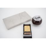 A Danish stainless steel table cigarette box, together with a brass Zippo lighter, model No 204, and