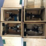 Four Opax binocular microscopes