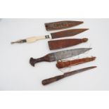 Three antique African knives / daggers, longest 43 cm