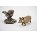 A novelty brass Vesta case in the form of a pig, together with a cast brass miniature modelled as