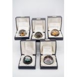 Five boxed Caithness limited edition glass paperweights including "Snow Flower", "Moonflower", "