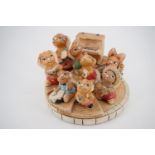 A Pendelfin display stand and eight assorted rabbit figurines all modelled as musicians or singers