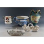 A Cauldon Ware blue-and-white chamber pot, Royal Doulton loving cup, and Victorian toothbrush holder