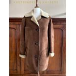 A lady's vintage HeaTona sheepskin coat, with stepped collar and rolled-back sleeves, 19" across the