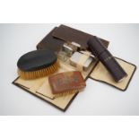 A vintage faux crocodile cased travel set, containing clothes brushes and glass jars, a Victorian