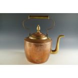 A large copper and brass kettle, 37cm