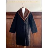 A lady's vintage Astra Furs of Paris Astrakhan coat with fur collar, 21" across the back, in lightly