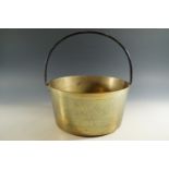 A brass jam pan