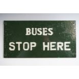 A tinplate "Buses Stop Here" sign, 20 cm x 39 cm