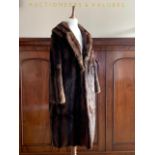 A lady's vintage faux-mink fox fur coat, with stepped collar and bracelet length sleeves, lined in