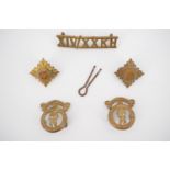 A pair of 14th / 20th (King's) Hussars collar badges, a brass shoulder title and rank pips