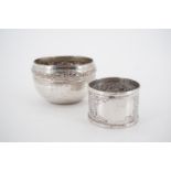 A south Asian white metal napkin ring and a small electroplate bowl, early-to-mid 20th Century