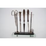 A 1930s silver manicure set stand by Sanders & Mackenzie, having a terraced glass and composition