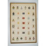 Three framed displays of early 20th Century cigarette silks depicting military badges, medals and