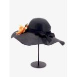 A 1960s Bermona boutique black floppy hat, with period applied brooch corsage