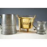 A pewter tankard, measure and brass pot