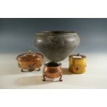 An Indian brass oviform cachepot, a planished copper pot, a brass drum-form box set with cabochons