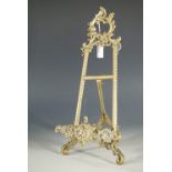 A cast brass easel stand, 33 cm