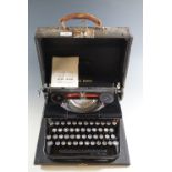 A vintage Blue Bird portable typewriter