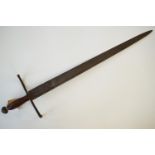 A late 17th / early 18th Century short sword, the hilt comprising a relic iron pommel of oblate