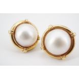 A pair of modern mabe pearl and high carat yellow metal statement earrings, each pearl being