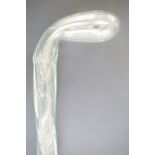 A Victorian free blown hollow glass walking cane, clear and spirally twisted, 107 cm