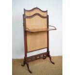 A Victorian carved mahogany adjustable fire screen with folding shelf