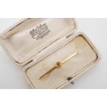 An antique 9ct gold and citrine bar brooch, the oval-cut citrine millegrain set to the face of a