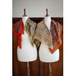 Four vintage Burberry silk scarves, in colour variations of the iconic 1920s check design, two in
