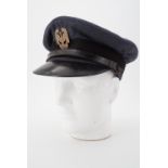 A 1940s RAF warrant officer's peaked cap with Polish Air Force badge affixed