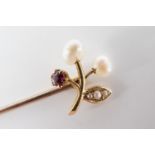 An antique seed pearl, almandine garnet and high-carat yellow metal stick pin, the terminal in the