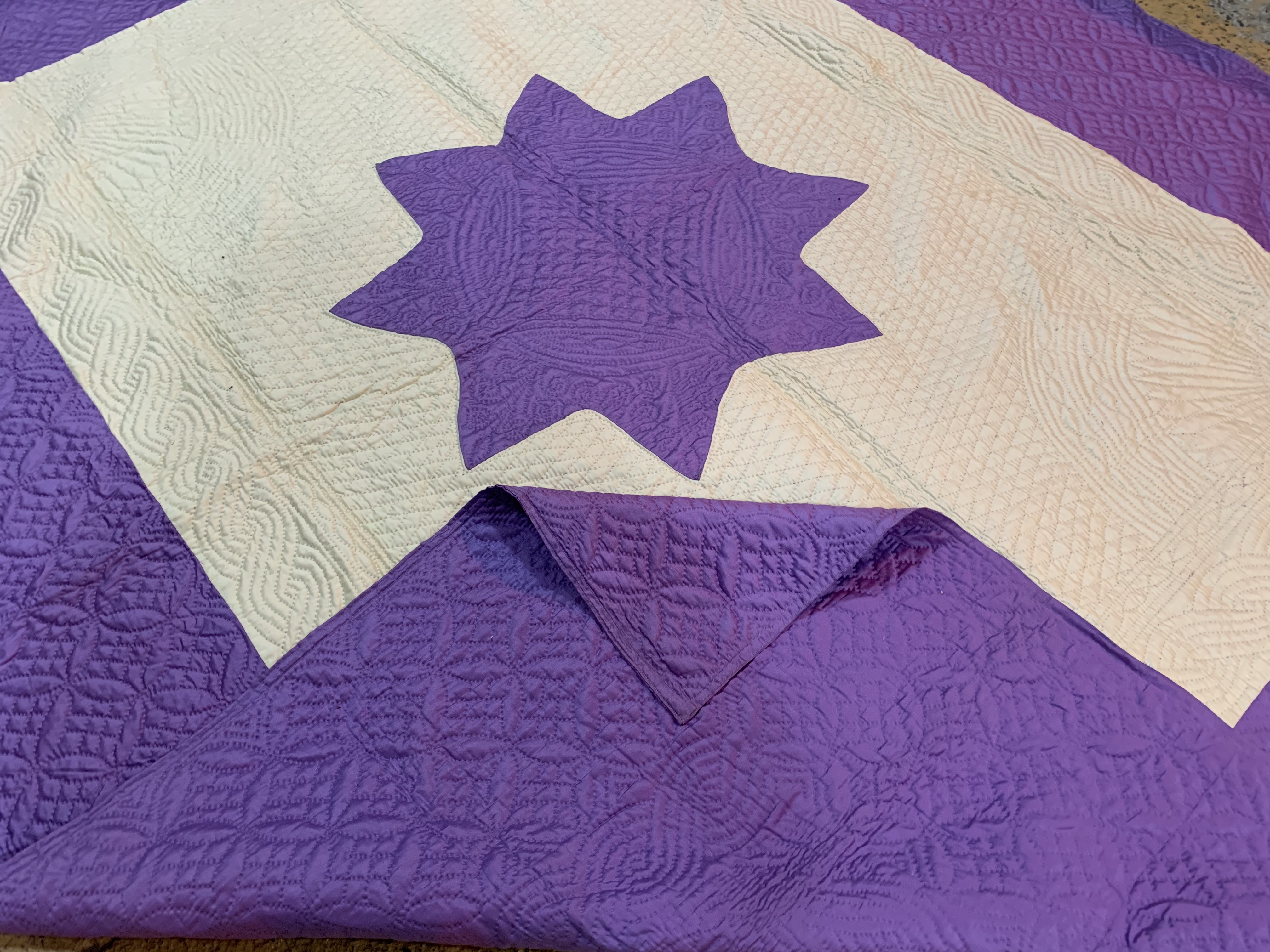An antique Durham quilt of bright violet cotton, with a soft satin sheen, 250 x 200, late 19th /