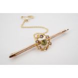 An antique high-carat yellow-metal, peridot and split-seed pearl bar brooch, with central round-