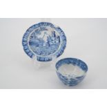 An early 19th Century toy or doll's blue-and-white transfer-printed pearl ware tea bowl and plate,