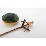 An antique yellow-metal Masonic stick pin, and a yellow-metal mounted beetle, the terminal from a