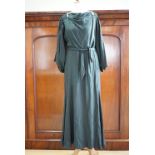 A 1930s dark fern green viscose evening dress with applied diamante double-dress clips, having a
