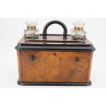 A Victorian ebonised and walnut veneered ink standish cum stationary cabinet, the top having an
