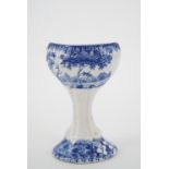 A 19th Century Spode pottery blue and white transfer printed eye bath, one face decorated with a