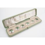 A cased set of six Keswick School of Industrial Arts enamelled white metal buttons, with lime