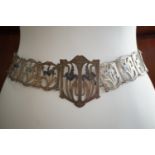 A Belle Epoque lady's silver plated belt of Art Nouveau influence, each plaque and the buckle