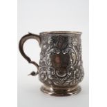 A Georgian silver cup, of slender and compressed baluster form over a circular foot, with