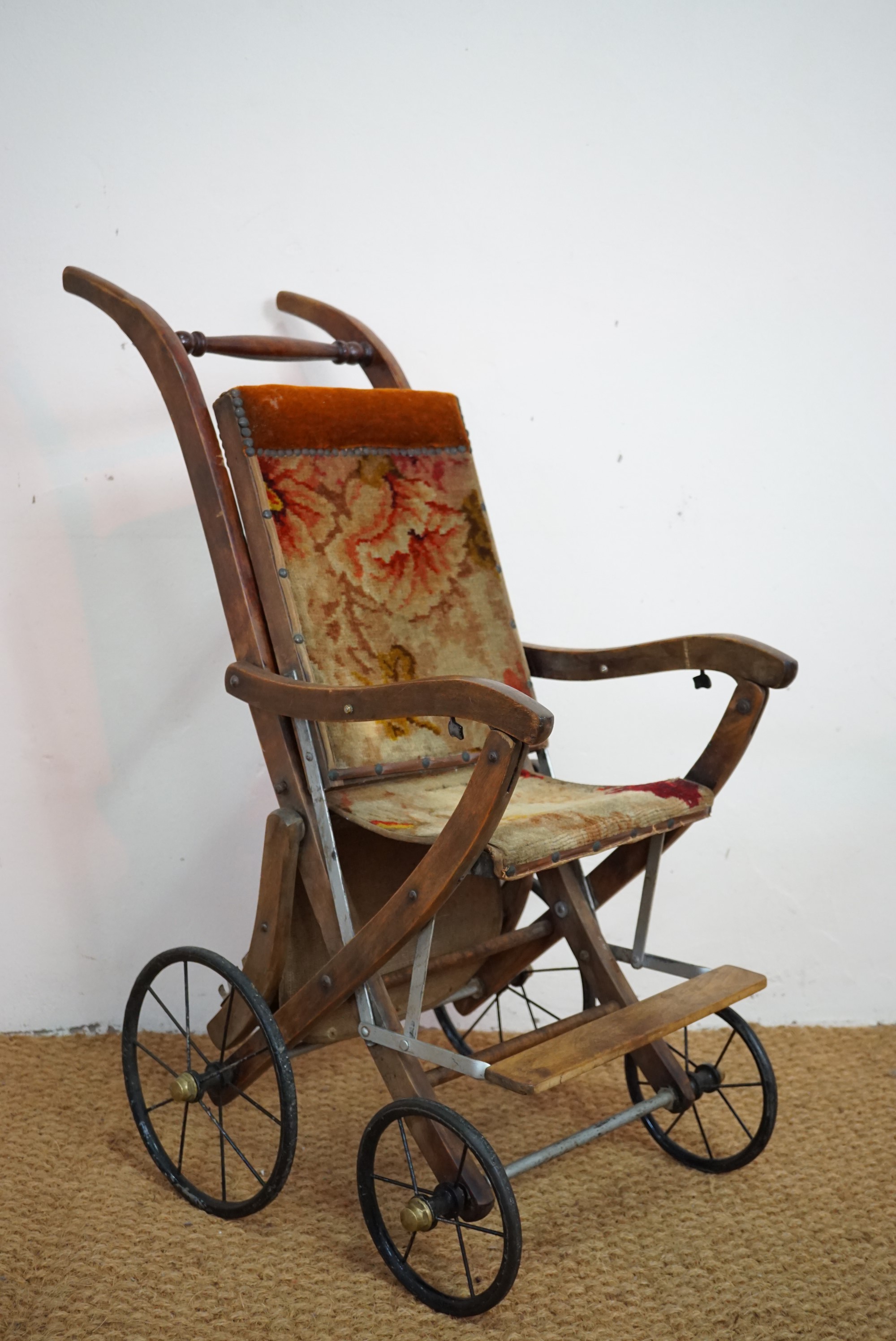 A late 19th / early 20th Century child's folding push chair