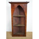 A William IV and later mahogany Gothic-influenced hanging corner cabinet, 99 cm high