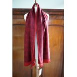 A contemporary Christian Dior wool scarf, in burgundy and plum, having a self patterned design